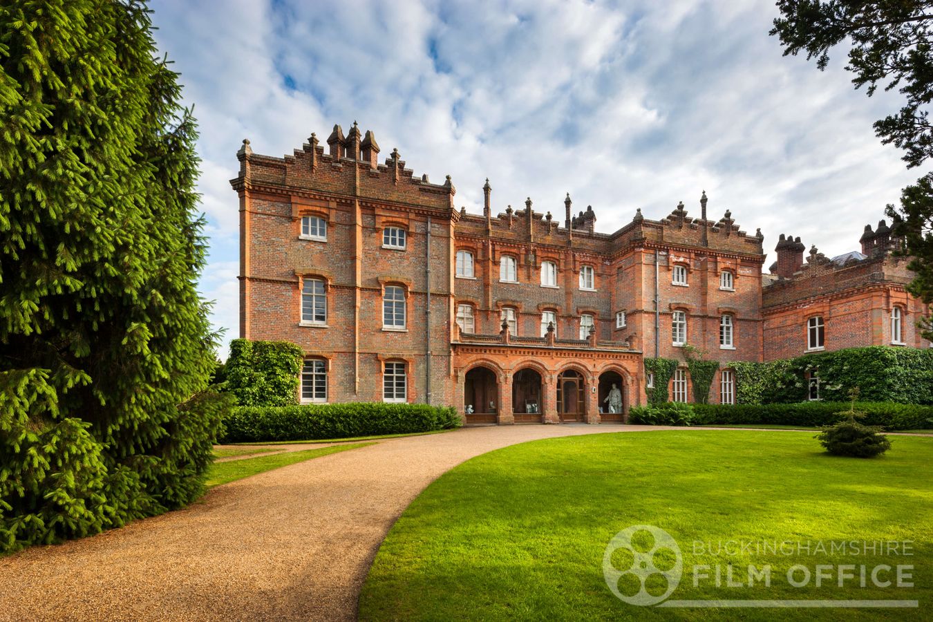 Hughenden Manor, a Victorian country house with sweeping lawn and ornate brick facade in Buckinghamshire