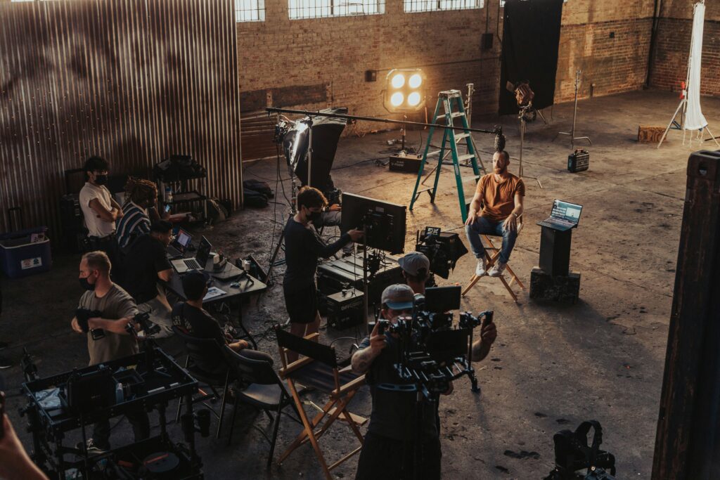 image of a film crew set up in a large warehouse