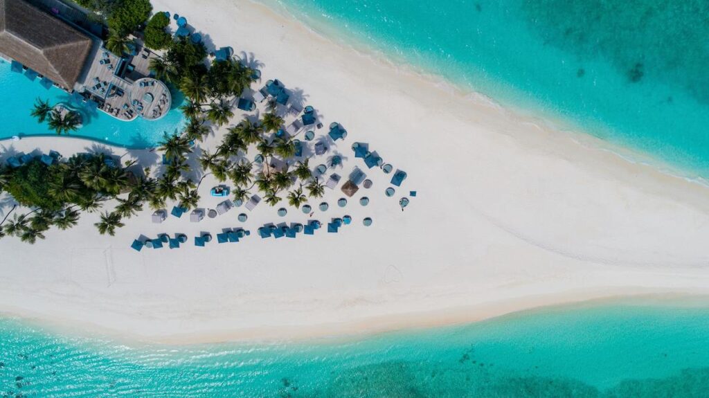 Aerial view of a white sand beach and resort