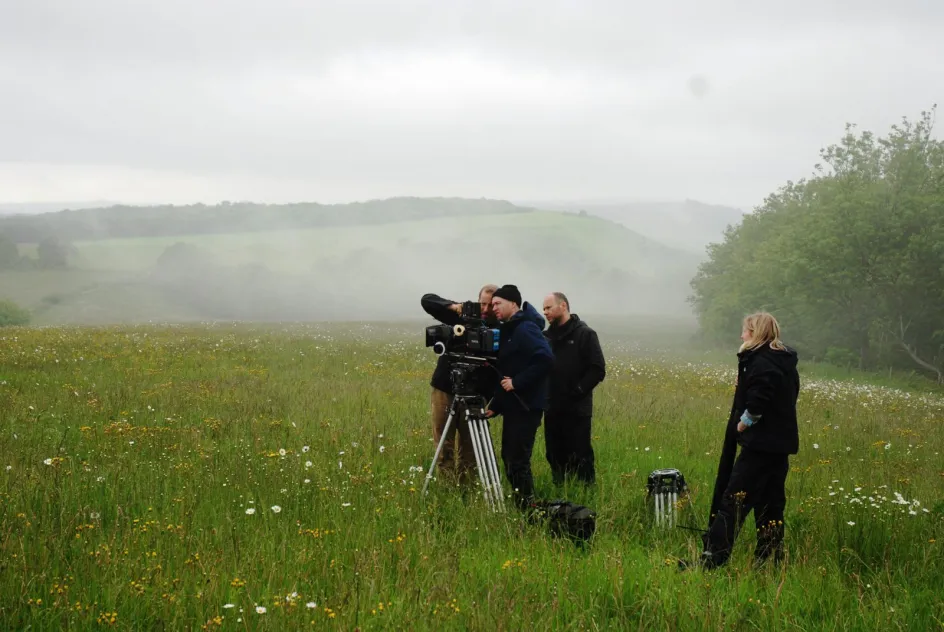Image of a shooting crew in the fields on Cowdray estate