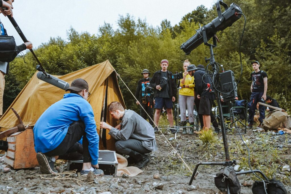 image of a film crew entering a tent 