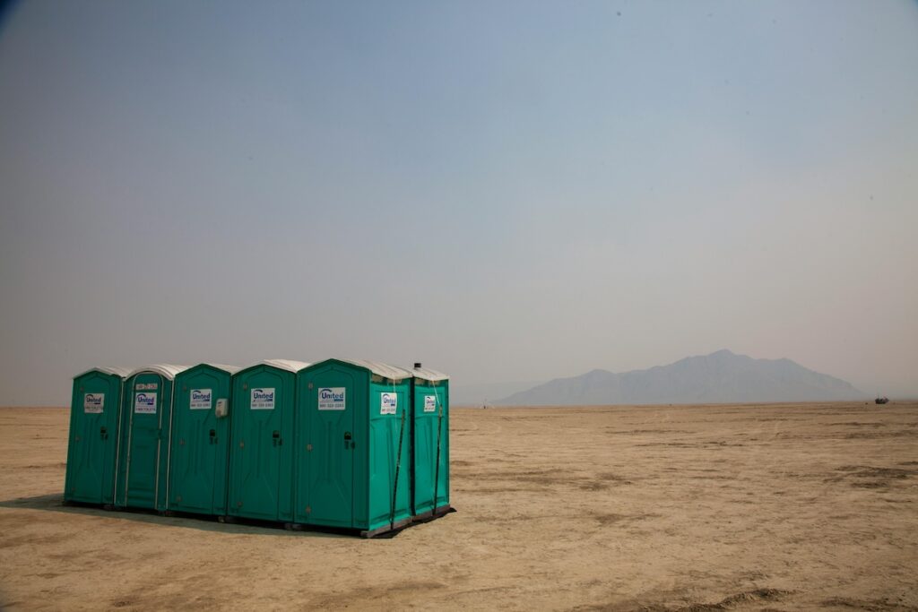 image of portable toilets in the desert