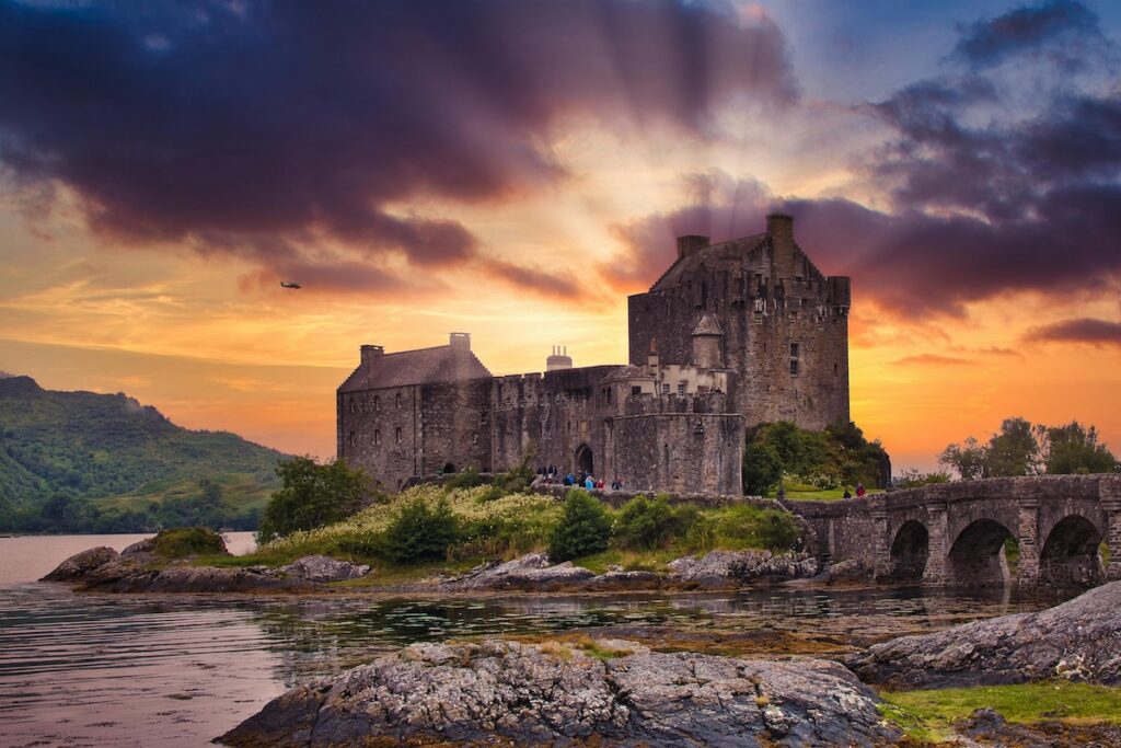 Medieval Eilean Donan Castle in Scotland at dusk