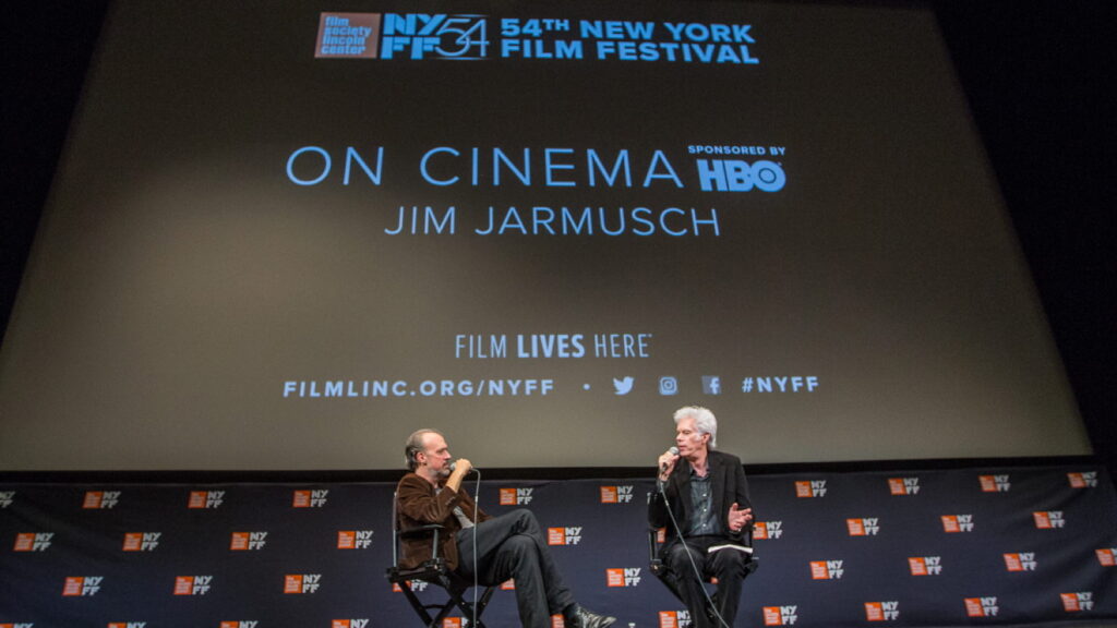 image of two men speaking on stage at the New York Film Festival