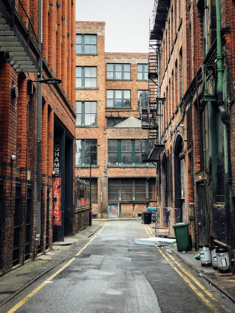 Red brick buildings down a side road in Norther Quarter, Manchester