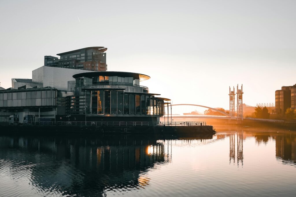 MediaCityUK building at sunset on the river at Salford Quays