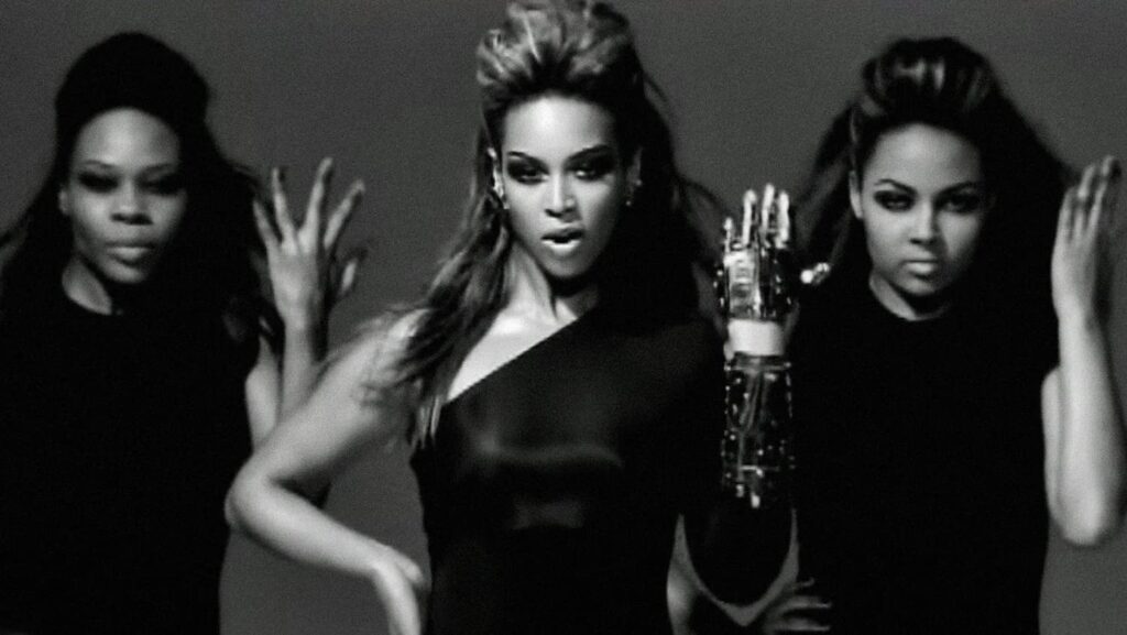 Beyonce and 2 backup dancers in music video for Single Ladies