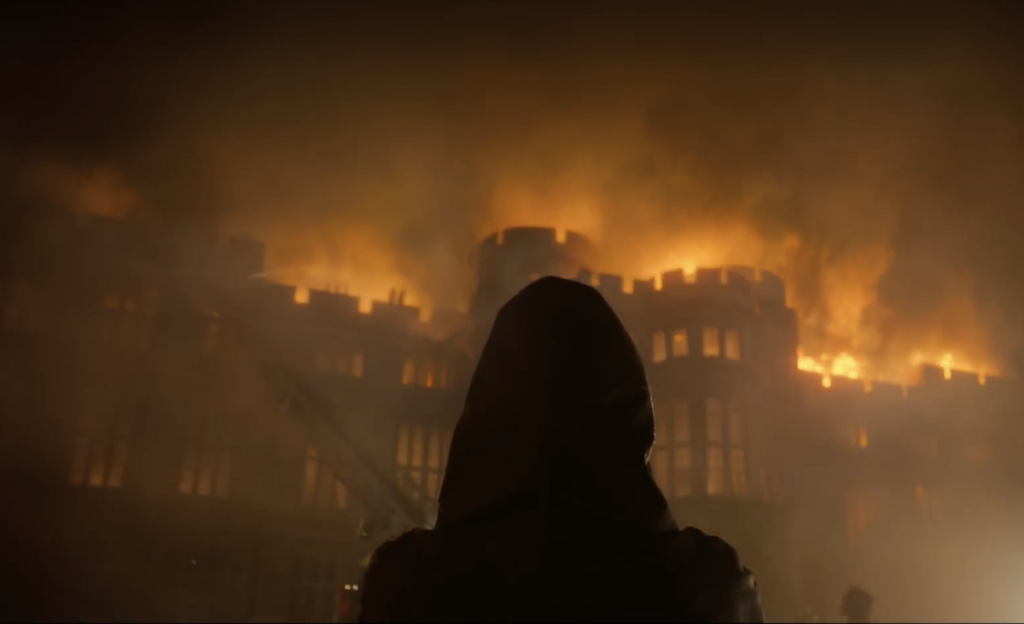 still from The Crown of Burghley House exterior used as Windsor Castle on fire