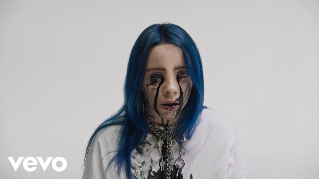 Billie Eilish in front of infinity cove screen in music video for When the Party's Over