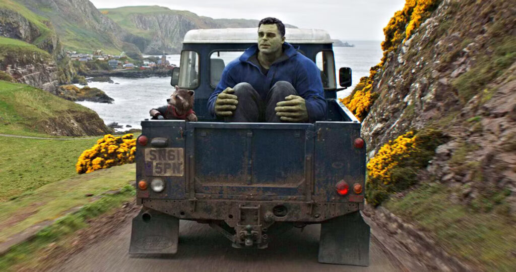 Film still from Avengers: Endgame (2019) showing the hulk sat in the back of a truck driving through the scottish countryside