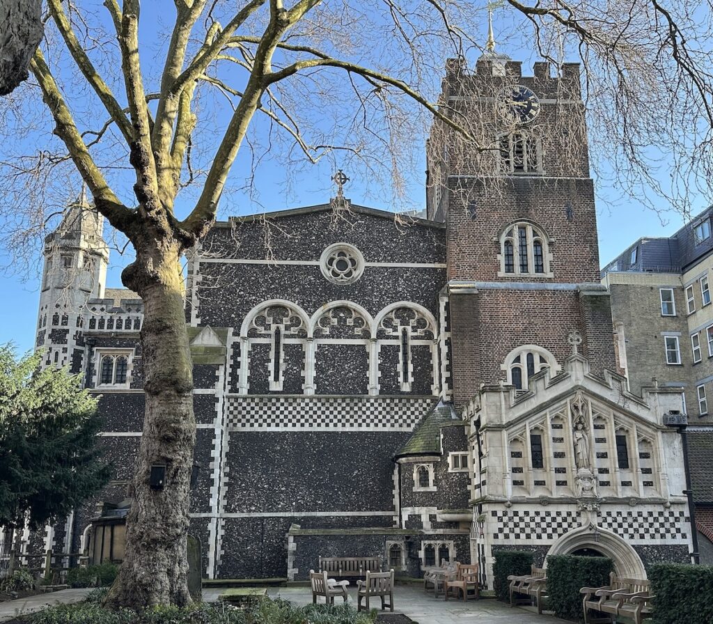 St Bartholomew the Great exterior with blue sky