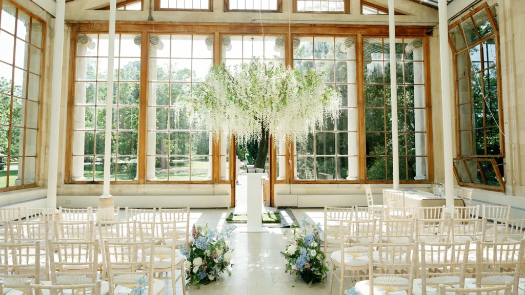 Wedding ceremony setup inside greenhouse at Kew Gardens